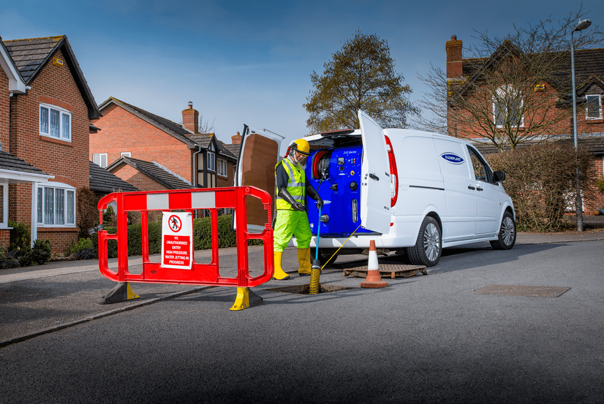 Duct Desilting taking place in a street