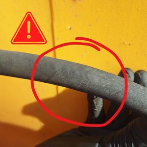 Damaging hose showing bulging section that will need to be replaced